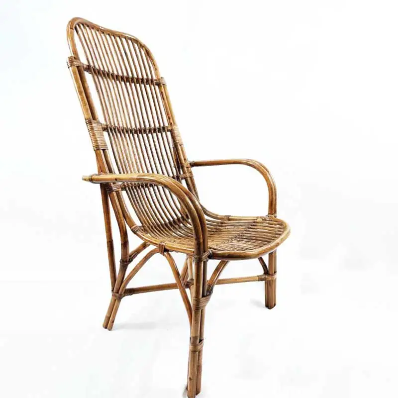 The Indo Highback Patio Chair is a high-back, natural rattan chair with armrests. It features vertical slats on the backrest and a woven seat, all supported by a sturdy, curved frame.