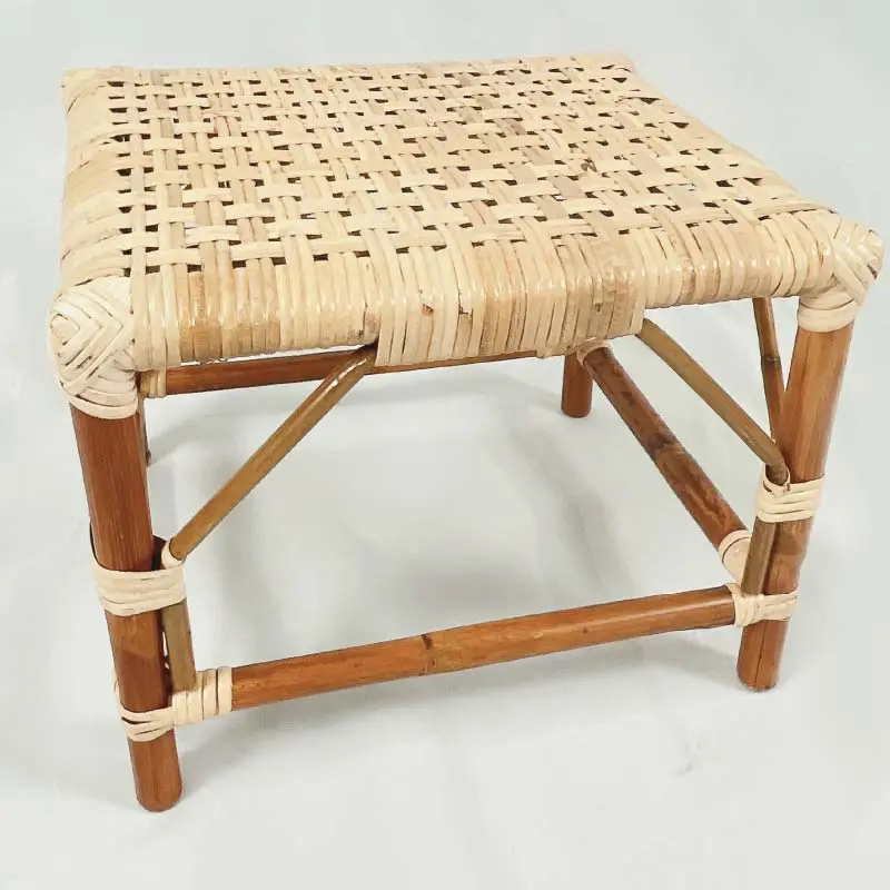 The RC Sewing Stool features a square woven cane seat, a wooden frame, and crossed support bars, all showcased on a white background.