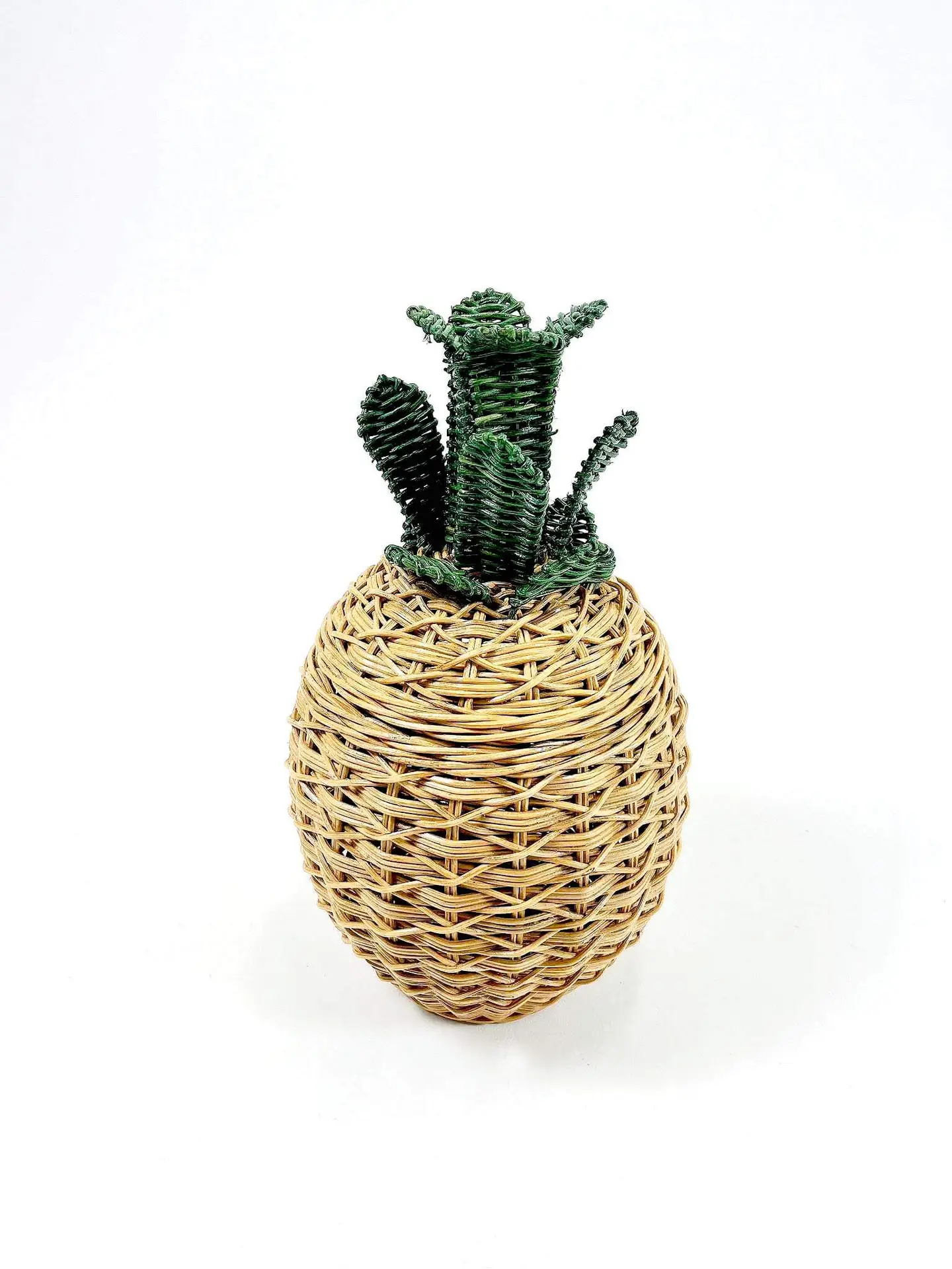 A round wicker basket designed to resemble a cactus plant with green woven elements extending from the top.