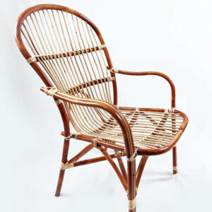 The RC Ipoh Chair, crafted from wood and rattan with a curved backrest and seat, featuring vertical slats and hand-tied joints, is displayed against a plain white background.