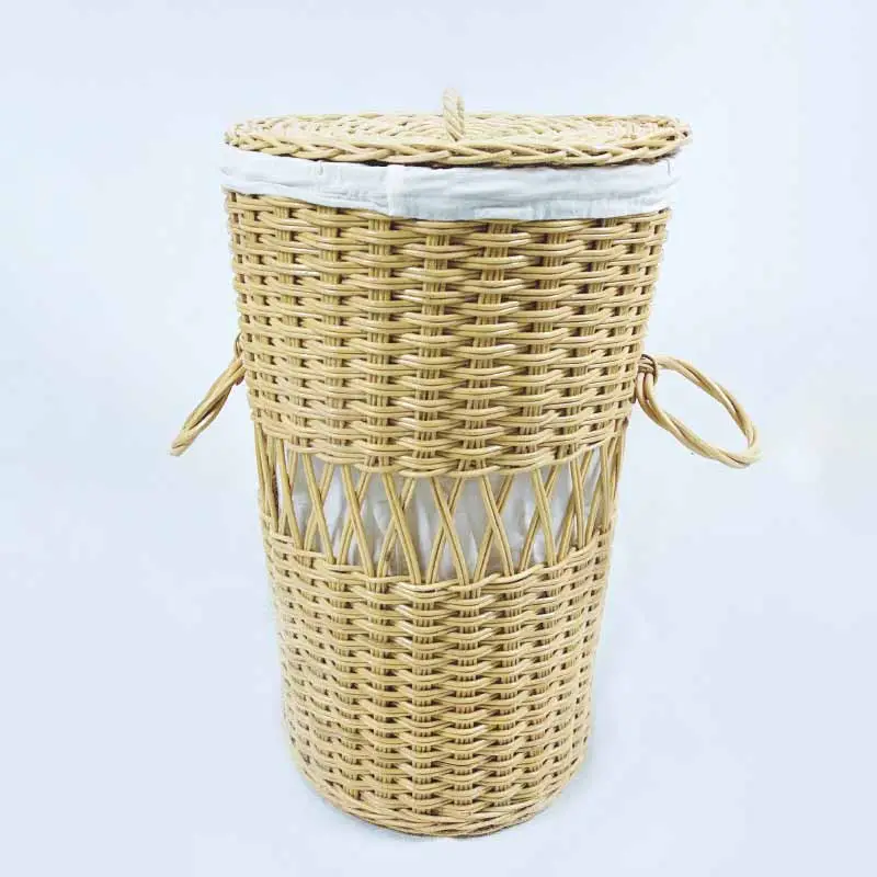 The Wicker Laundry Basket is a tall, round basket featuring a lid and two side handles, with a section of diagonal weaving design near its center.