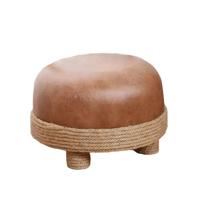 A small round stool with a padded, leather-like top. The base and legs are wrapped in rope.