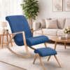 The Diane Rocking Chair with Footrest (Clearance) sits on a beige rug in a modern living room featuring neutral decor, a sofa, coffee table, and potted plant.