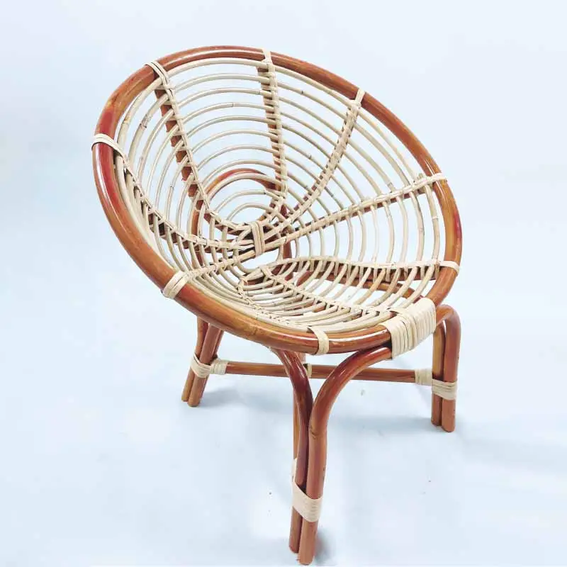 The RC Coil Hami Chair 20" features a compact design with a circular woven seat and backrest, supported by an intricate frame of intertwined rattan legs and braces.