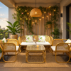 A cozy balcony setup featuring the Zorba Sofa Set, a glass-top table, potted plants, string lights, and cityscape views at sunset.