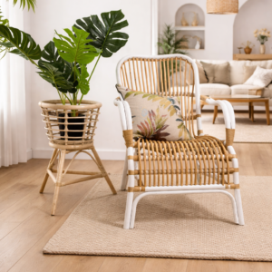 A Classic White Chair sits next to a potted plant on a woven mat in a bright, modern living room with wooden flooring.